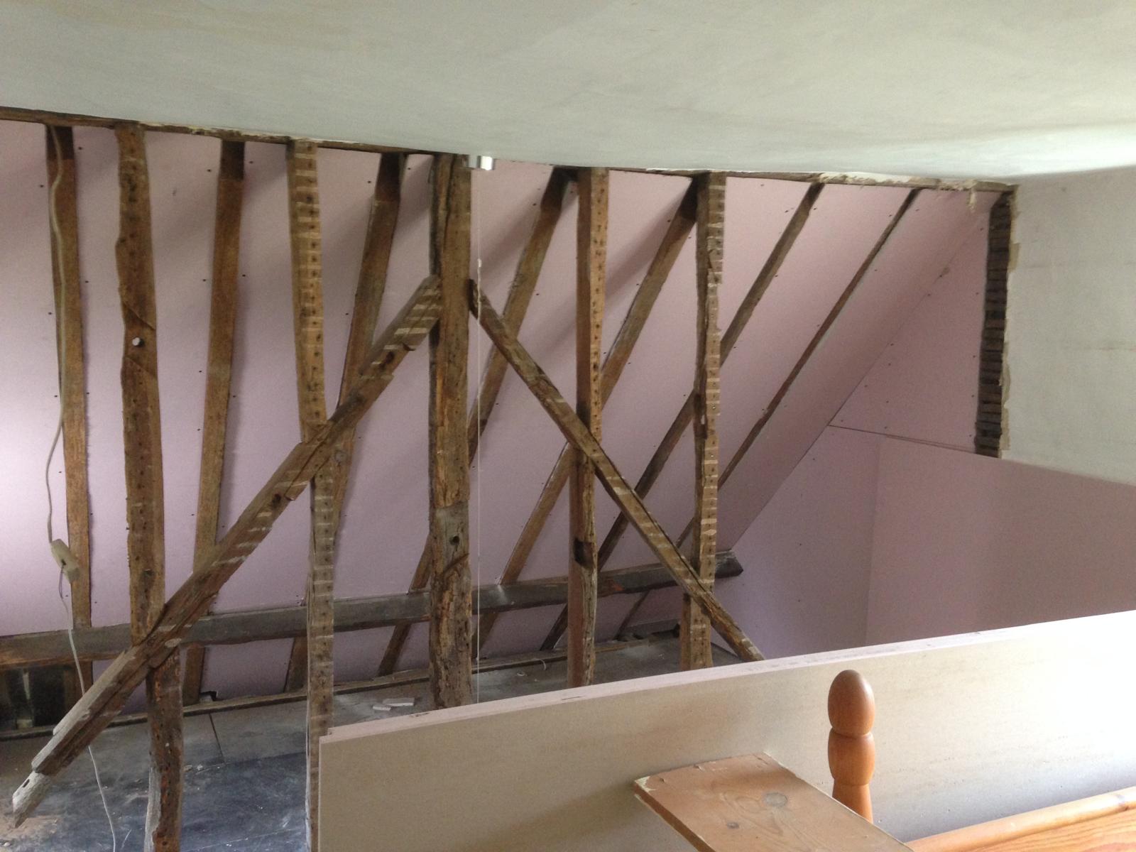 Wooden beams to be restored and painted for a local decorating project in Kent