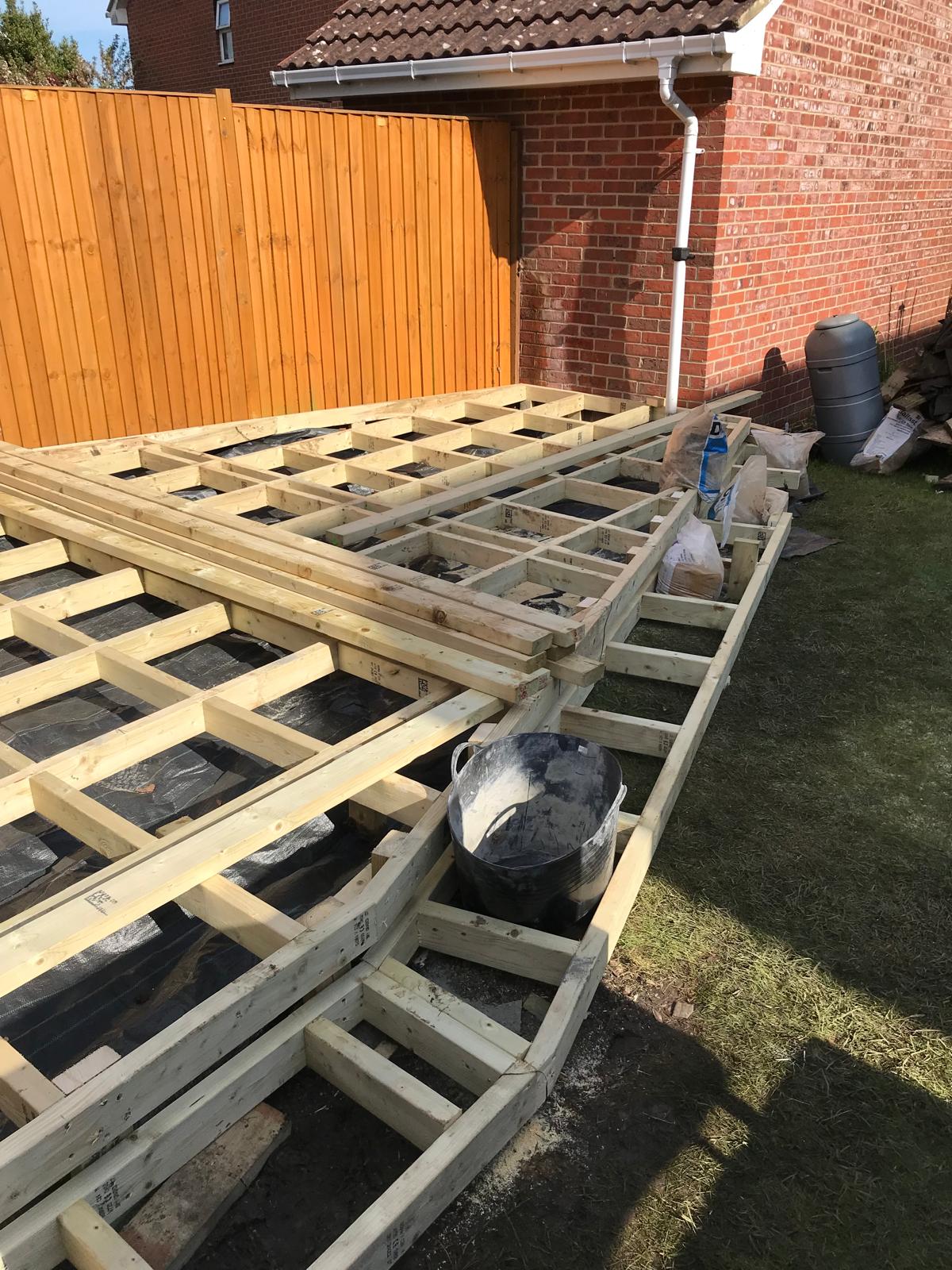 Wooden frame installation for a decking installation project