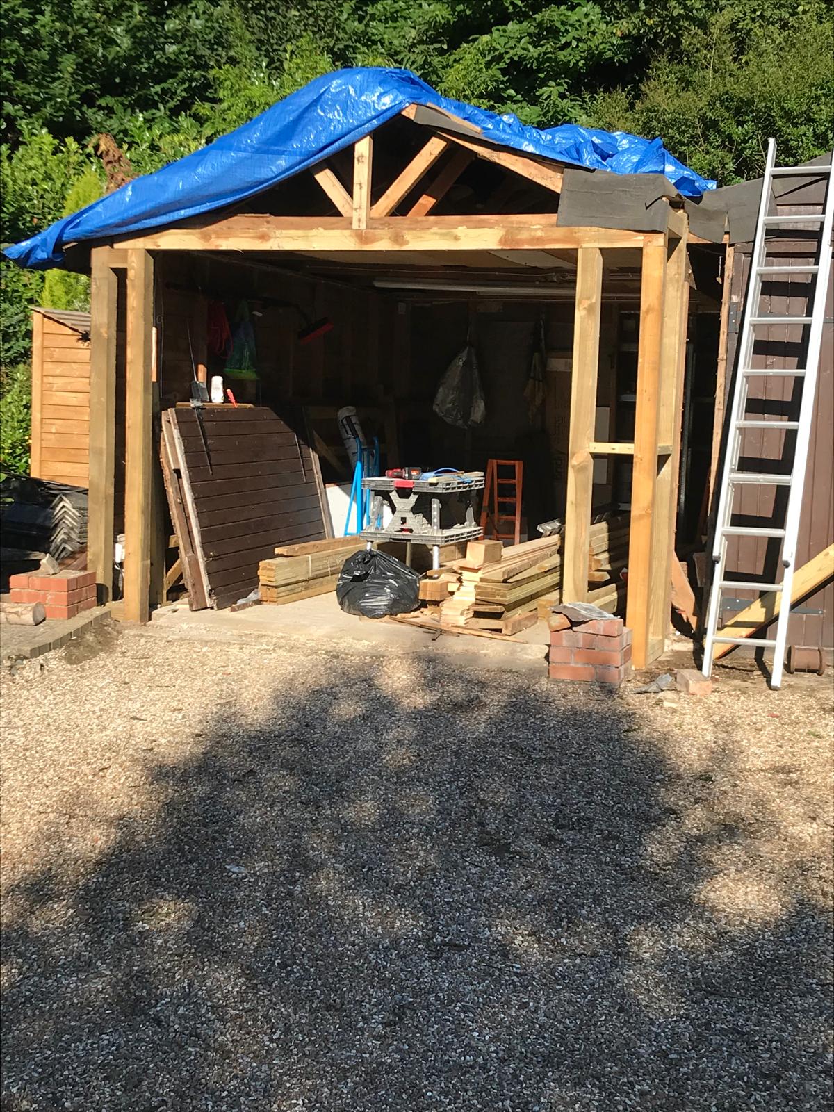 Wooden garage roof and door installation