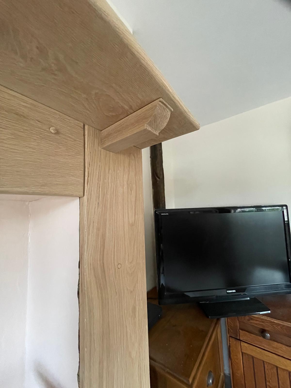Wooden mantel installation for a decorating project in Kent
