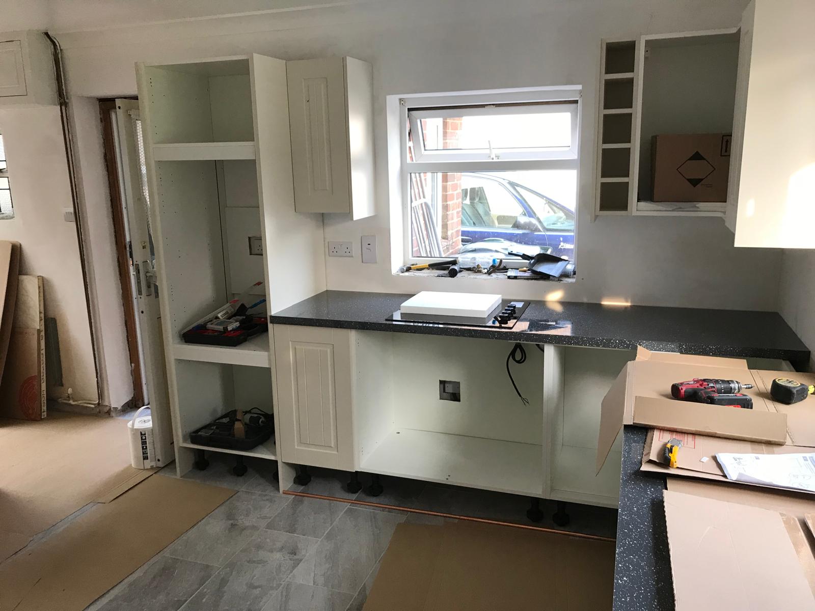 Worktops being installed on a kitchen installation project in Kent