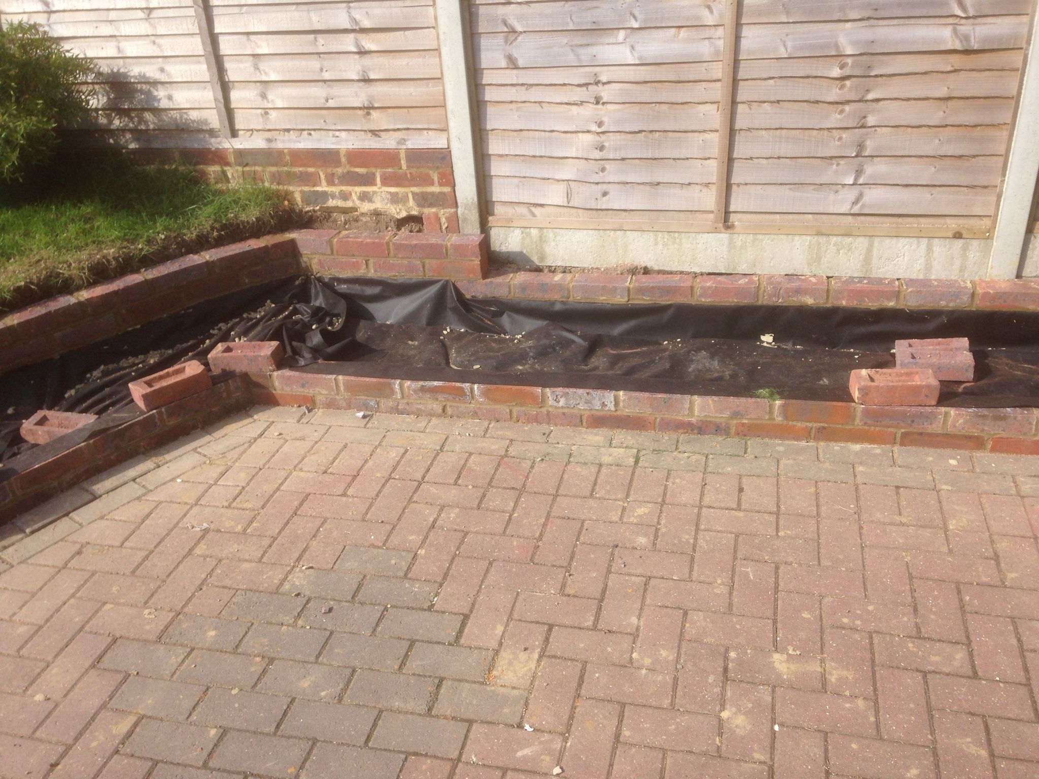 local landscaping project with brick border installation